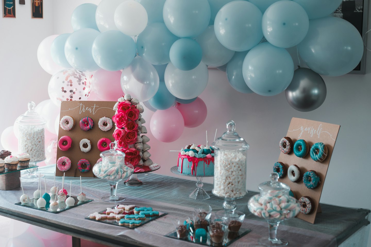 A dessert table filled with colorful sweets for a celebration.